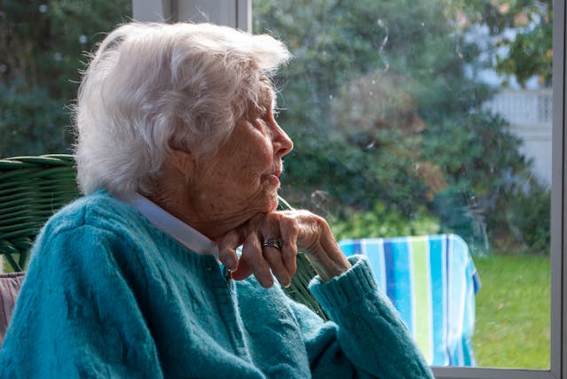 old-woman-looking-out-the-window