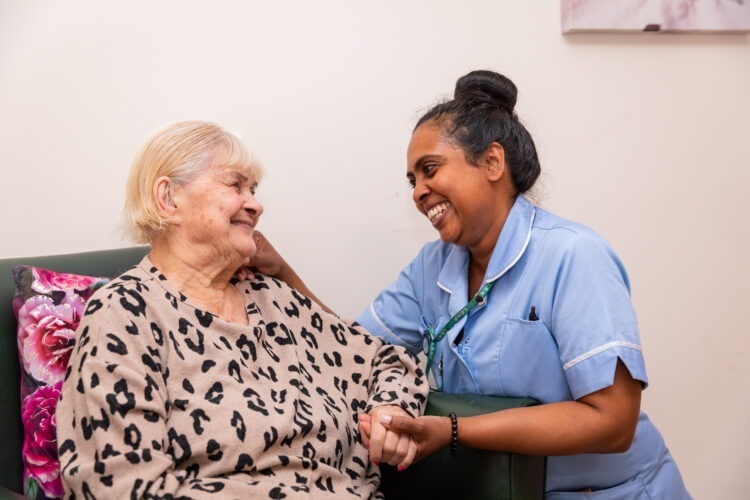resident sitting with carer