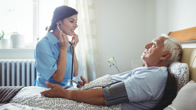 Nurse taking blood pressure