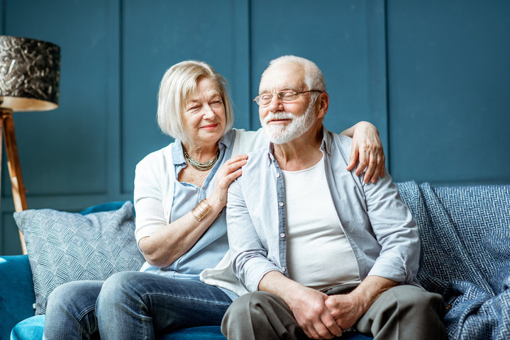 older couple sitting down in the room